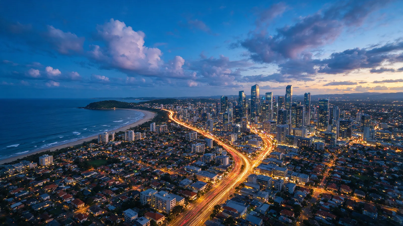 Seedream 5 Pro API cinematic scene example - coastal city aerial view at blue hour